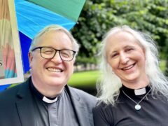 Clergy smiles at Pride 2023